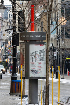 MONTREAL, CANADA, 23 December 2025 : Winter street scene, city map, urban signage, Montreal, snow-covered road, city architecture, street trees