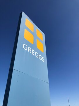 GREGGS signpost with blue sky background in Wyberton Lincolnshire, UK. April 2026: 