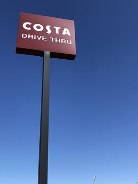 COSTA drive thru signpost with blue sky background in  Wyberton Lincolnshire, UK. April 2026: 