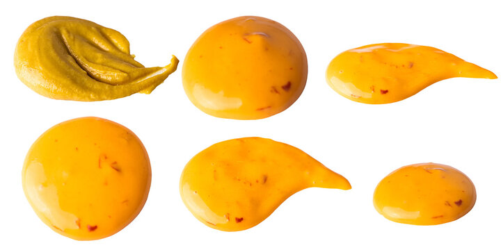 Various shapes and sizes of yellow mustard and sauce blobs isolated on a transparent background for culinary and food-related design purposes isolated image