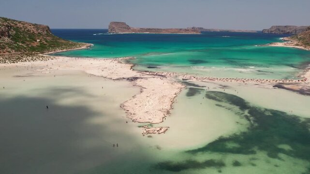 Aerial establishing shot of Balos beach lagoon and exotic island coast