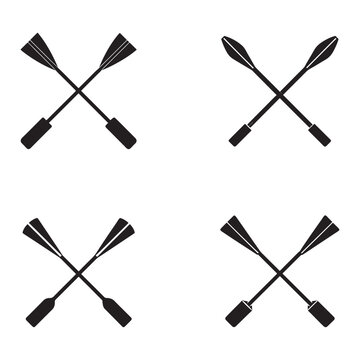 Four black silhouettes of crossed oars in different positions on white background for rowing or kayaking concepts  isolated on white background