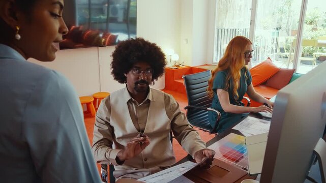 Multiethnic small group of businesspeople meeting in a coworking company office