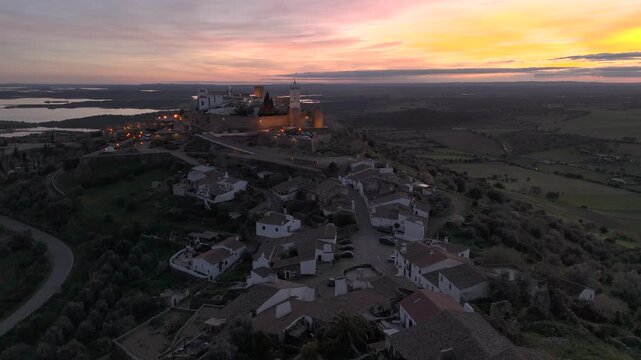 Golden sunset over Monsaraz, a timeless medieval village in the heart of the Alentejo. Warm light, rolling plains and the calm atmosphere of rural Portugal captured in cinematic detail.