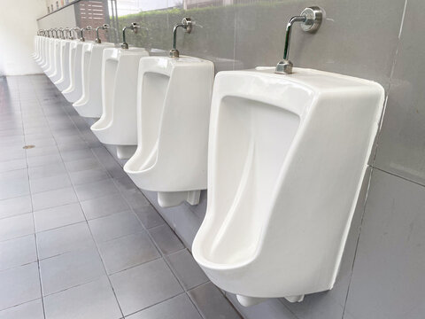 old urinal in public toilet