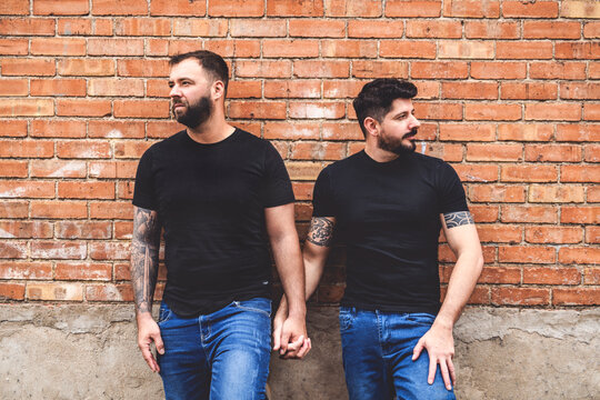 A Portrait of a happy gay couple outdoors in urban background