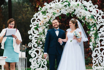 wedding ceremony of the newlyweds on the glade © omelnickiy