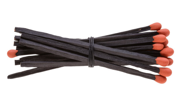 Isolated bundle of dark wooden matches with vibrant red heads tied together with string