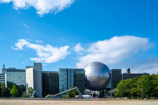 Nagoya, Japan,  July 30, 2024: FUJI NAGOYA SCIENCE MUSEUM with iconic silver sphere planetarium, Aersospace Rockets and sundial sculpture in Nagoya, Achi, Japan,.