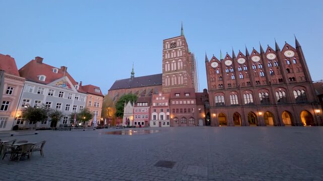 Stralsund, Germany - panorama of Alter Markt square at dusk with old Town Hall and Nikolaikirche church