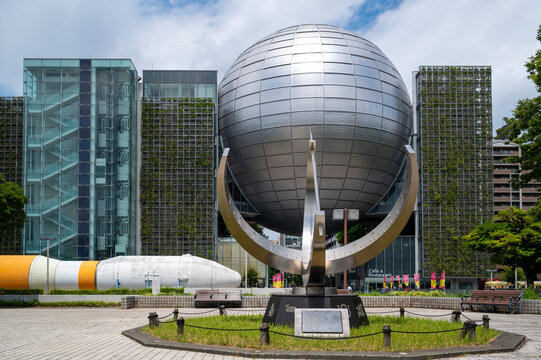 Nagoya, Japan,  July 30, 2024: FUJI NAGOYA SCIENCE MUSEUM with iconic silver sphere planetarium, Aersospace Rockets and sundial sculpture in Nagoya, Achi, Japan,.