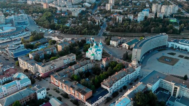 Drone view of the Resurrection Cathedral in the center of Sumy, Ukraine. Historical Orthodox monument against the backdrop of the cityscape. Urban architecture of the city of Sumy from a drone