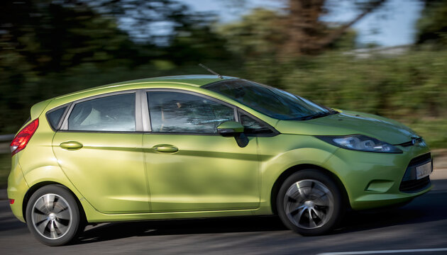 Milton Keynes,Bucks,UK - May 24th 2026:  2009 green Ford Fiesta car driving on a British road
