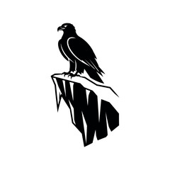 Fototapeta premium Silhouette of an eagle perched on a rocky cliff.