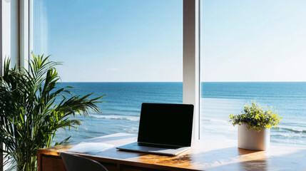 Obraz premium Home office desk with laptop overlooking calm ocean view, natural daylight inspiring remote work productivity