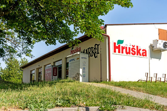 vesnice Vrahovice, Czech Republic - May 10, 2026: obchod HRUSKA Rural grocery store building with parcel lockers in Czech village