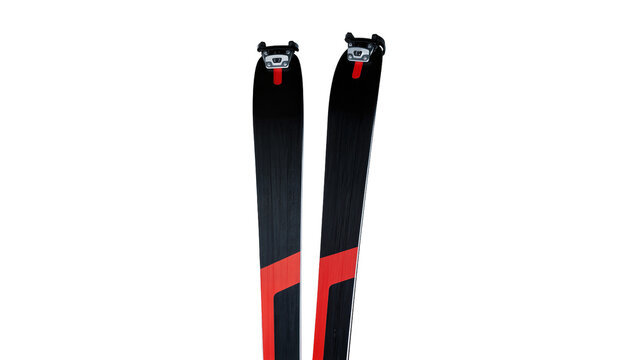 Isolated modern black and red touring skis with bindings standing upright, outdoor sport equipment