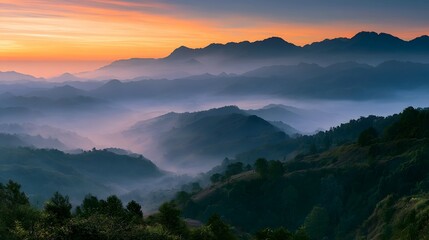 Obraz premium Majestic panoramic mountain range bathed in soft vibrant morning light and atmospheric haze