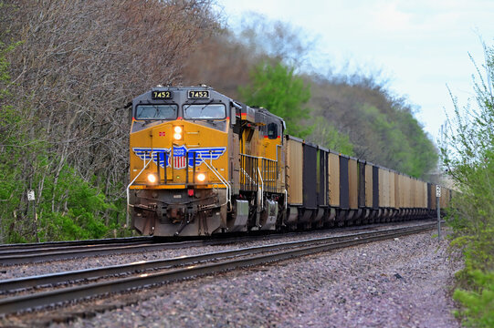 A westbound Union Pacific Railroad empty coal train rumbles through a Chicago suburb destined for the Wyoming mines to obtain new loads.