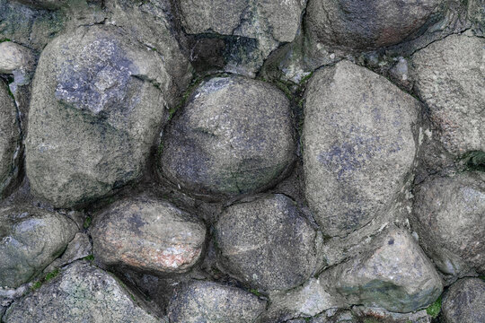 Close up view of a man made stone wall.