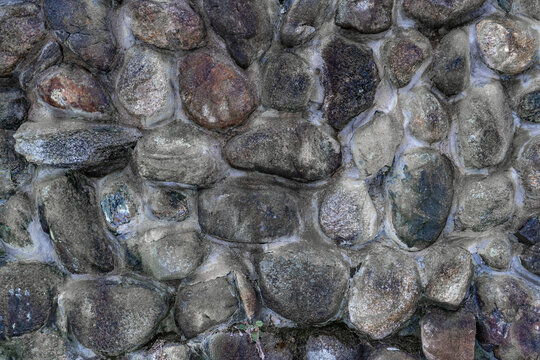 Close up view of a man made stone wall.