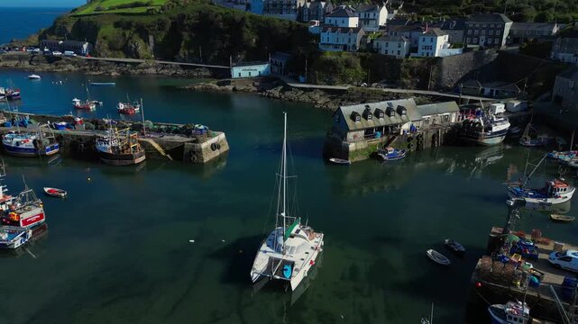 Aerial views of the harbor in the costal village and port of Mevagissey on the south coast of Cornwall in the southwest of England.
