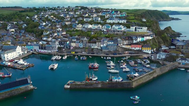 Aerial views of the harbor in the costal village and port of Mevagissey on the south coast of Cornwall in the southwest of England.