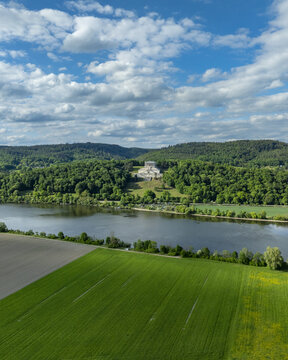 Aerial view of the Walhalla memorial monument on a forested hill overlooking the Danube river in Donaustauf, Bayern, Germany.