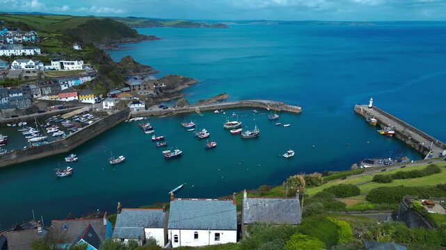 Aerial views of the harbor in the costal village and port of Mevagissey on the south coast of Cornwall in the southwest of England.