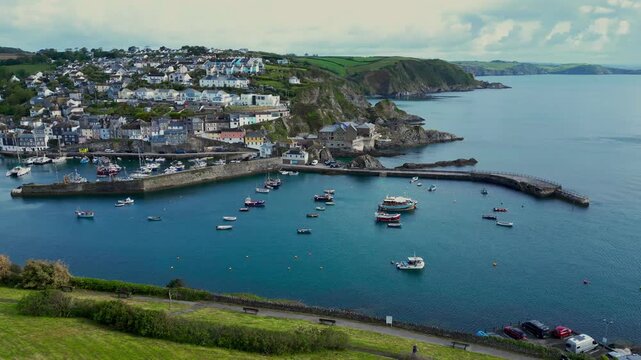 Aerial views of the harbor in the costal village and port of Mevagissey on the south coast of Cornwall in the southwest of England.