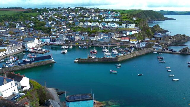Aerial views of the harbor in the costal village and port of Mevagissey on the south coast of Cornwall in the southwest of England.