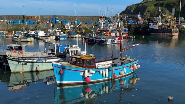 Aerial views of the harbor in the costal village and port of Mevagissey on the south coast of Cornwall in the southwest of England.