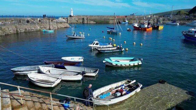 Aerial views of the harbor in the costal village and port of Mevagissey on the south coast of Cornwall in the southwest of England.
