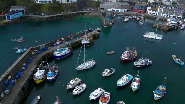 Aerial views of the harbor in the costal village and port of Mevagissey on the south coast of Cornwall in the southwest of England.