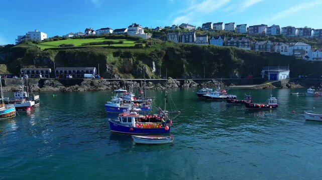 Aerial views of the harbor in the costal village and port of Mevagissey on the south coast of Cornwall in the southwest of England.