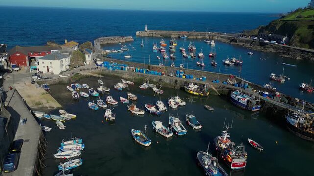 Aerial views of the harbor in the costal village and port of Mevagissey on the south coast of Cornwall in the southwest of England.