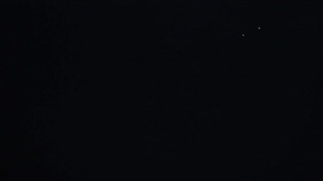 Streaking from edge, three comets looping into center, forming glowing ring with trails and stars