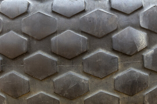 Close-up of rugged hexagon pattern on heavy-duty rubber