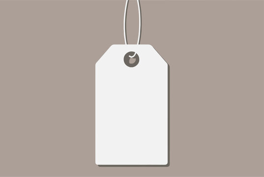 Blank white rectangular price tag or clothing label hanging by a thin white string against a tan background.