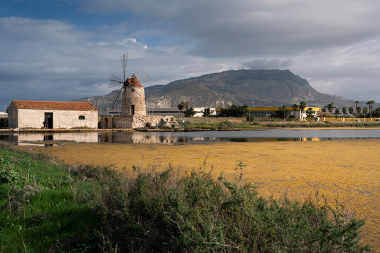 Windmills at the natural reserve of the "Trapani salt pans " near Marsala and Trapani, Sicily - salt evoporation pond in Trapani,  Sicily island, Italy