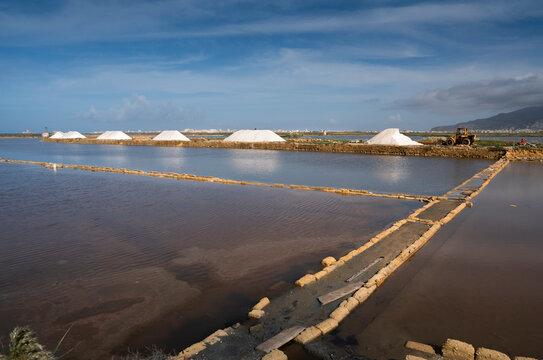 Windmills at the natural reserve of the salt pans near Marsala and Trapani, Sicily - salt evoporation pond in Trapani, Sicily island, Italy