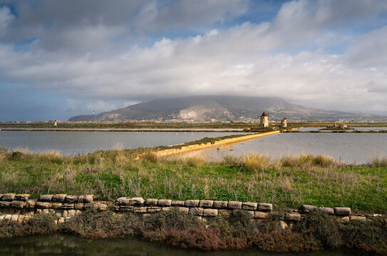 Windmills at the natural reserve of the "Trapani salt pans " near Marsala and Trapani, Sicily - salt evoporation pond in Trapani,  Sicily island, Italy