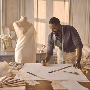 Fashion designer creating wedding dress patterns in a luxury atelier, showcasing bridal couture craftsmanship and creative elegance.
