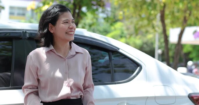 Stressed woman beside a car outdoors, Businesswoman missed career goals, representing frustration, unemployment, anger, pressure, waiting and failure, Thai Asian woman