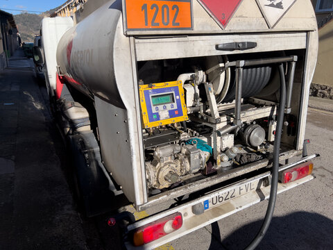 Olot, Spain; February 6 2026: Fuel tank truck delivering petroleum product using hose