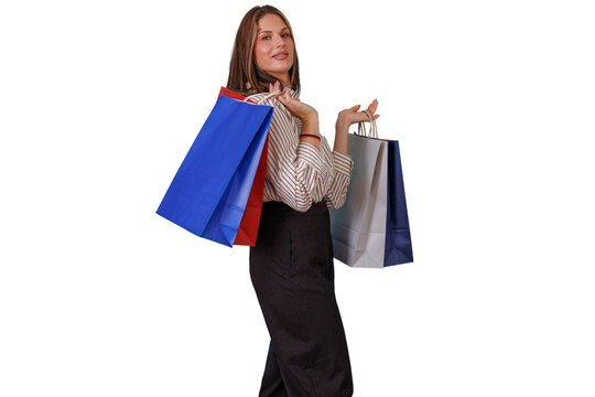Woman smiling, holding colorful shopping bags after successful retail therapy, enjoying shopping experience