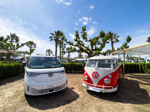 Sant Pere Pescador, Spain; May 20 2023: The microbus and camper Volkswagen T1 Kombi and new electric ID Buzz at an exhibition in camping