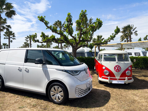 Sant Pere Pescador, Spain; May 20 2023: The microbus and camper Volkswagen T1 Kombi and new electric ID Buzz at an exhibition in camping