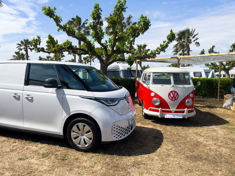 Sant Pere Pescador, Spain; May 20 2023: The microbus and camper Volkswagen T1 Kombi and new electric ID Buzz at an exhibition in camping