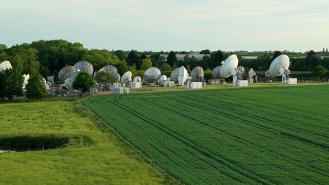 High angle view of telecommunications infrastructure displaying multiple satellite dish receivers in the Warwickshire countryside